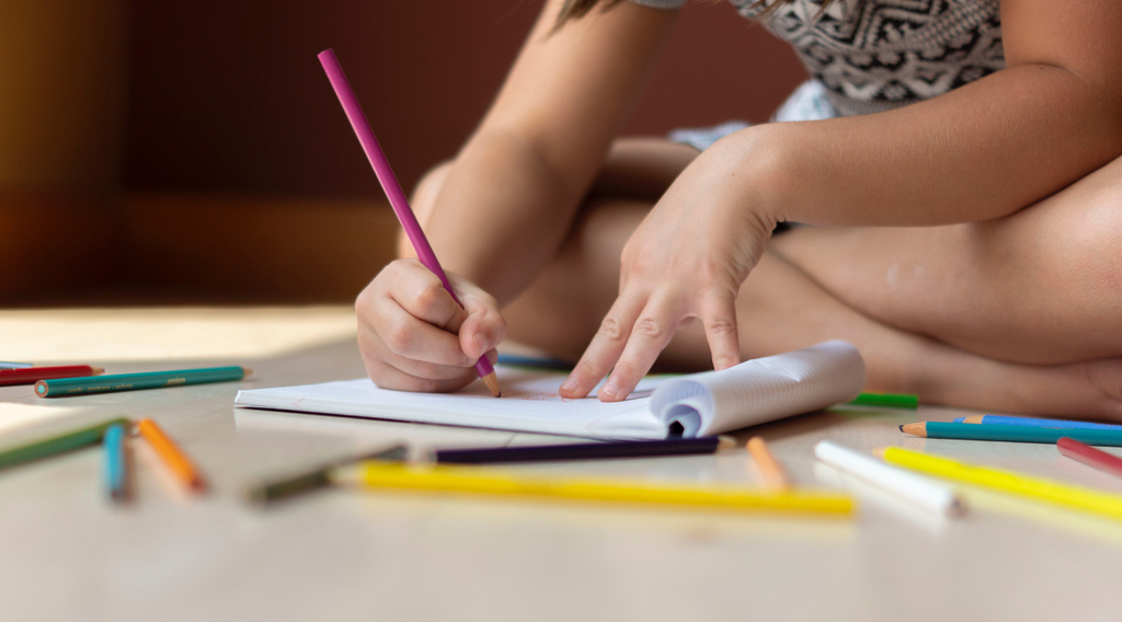 Children playing with their school supplies