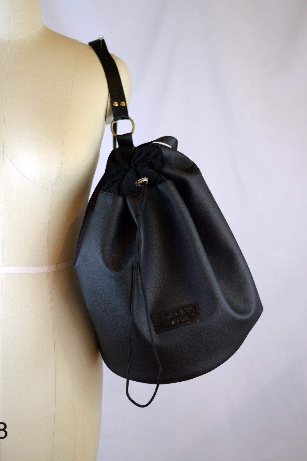 black faux leather bucket bag