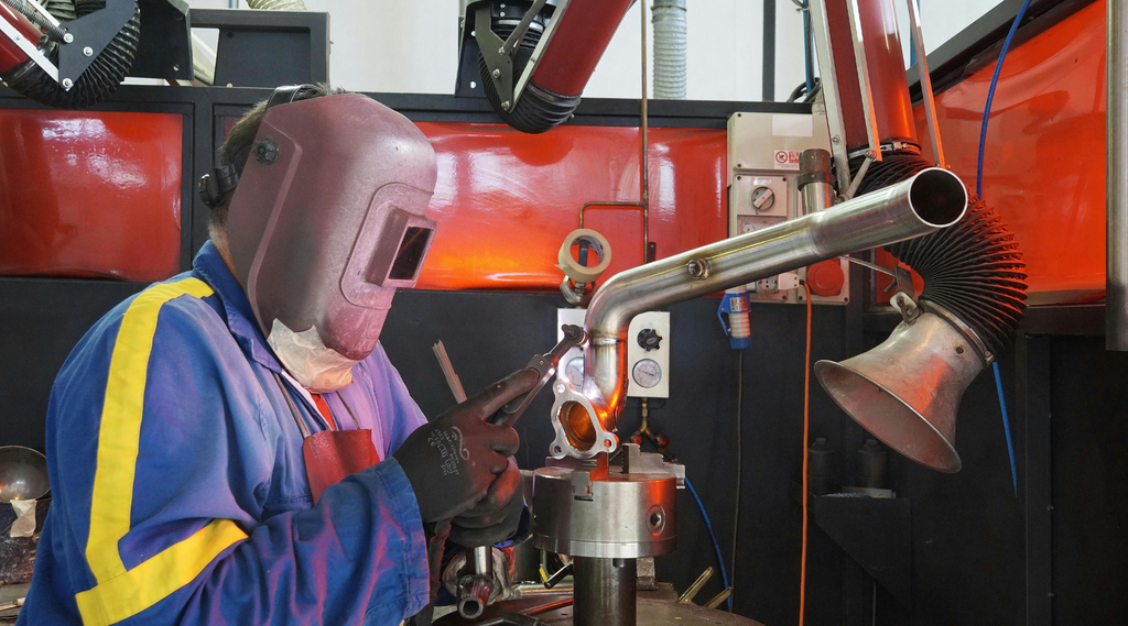 Welder wearing a welding helmet