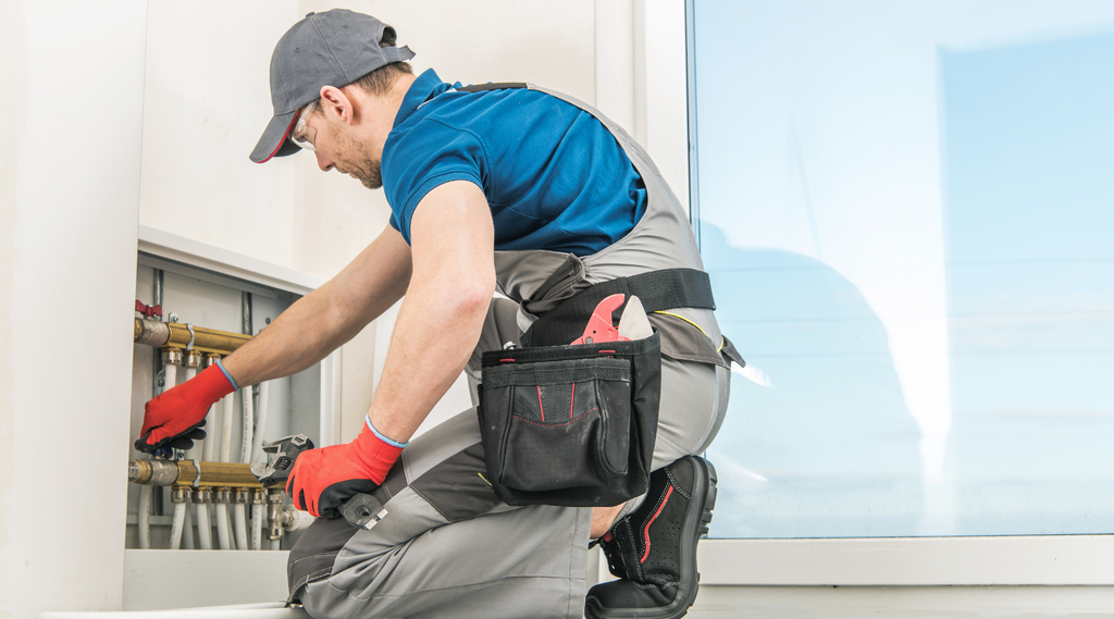 a plumber doing inspection for maintenance