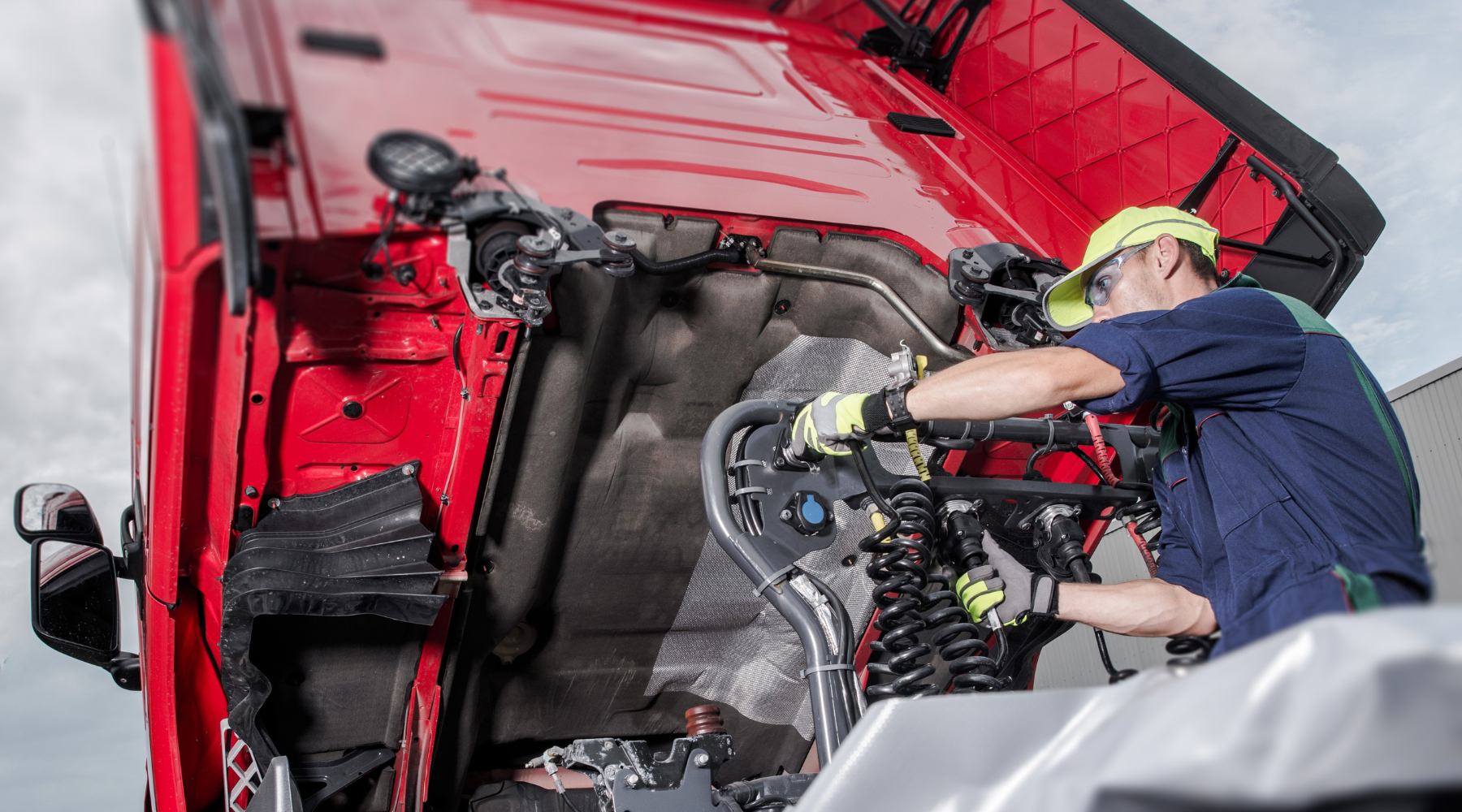 worker on truck maintenance task