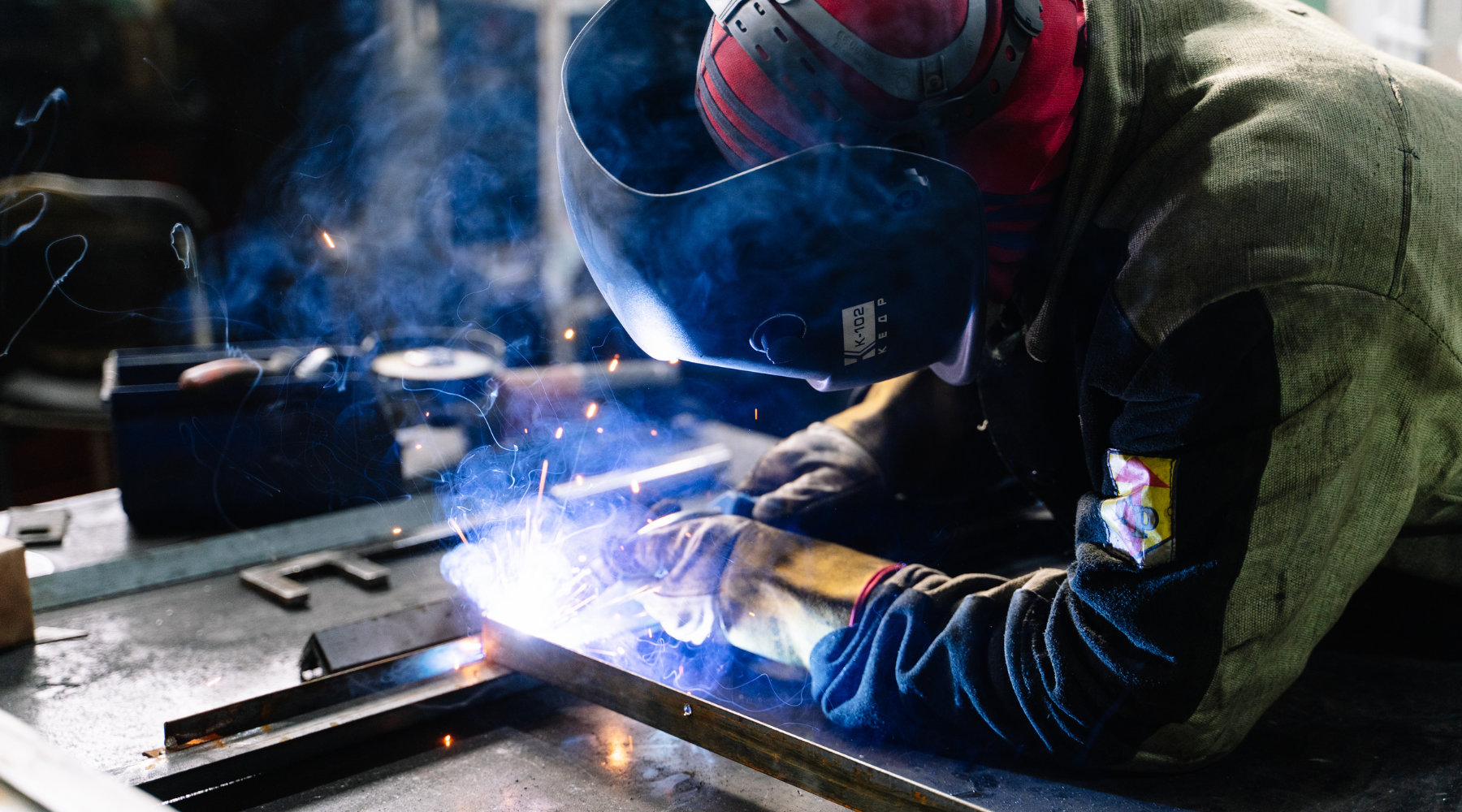 worker welding metals