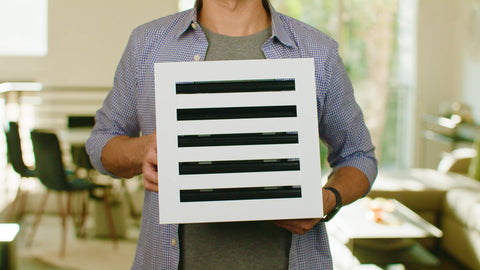 customer holding a 10x10 Standard Linear Slot Diffuser Air Vent Cover