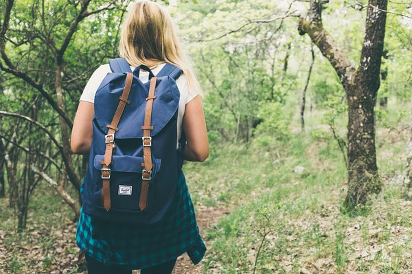 girl with camping backpack 