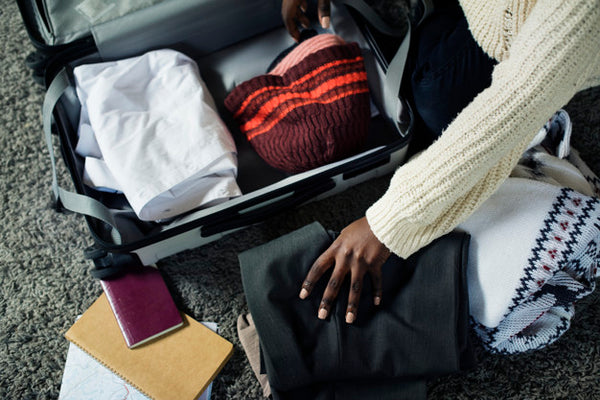 Woman-Packing-Travel-Bag