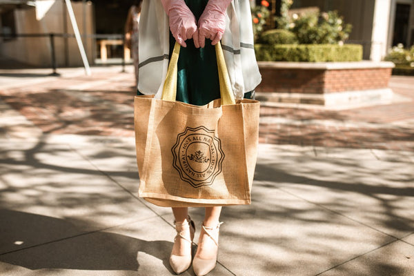 woman holding a reusable promotional bag