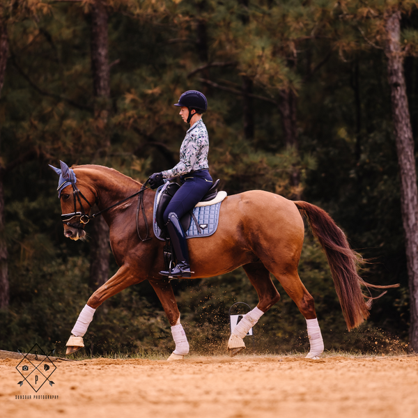 Megan Compton TDR Sponsored Trainer riding a chestnut horse. Photo by Sunsoar Photography