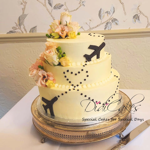 Wedding cake with planes and flowers