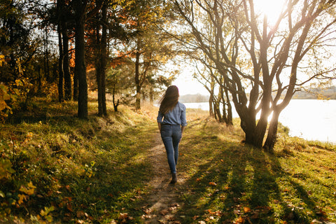 woman walking through nature,  motherhood, maternity, pregnancy