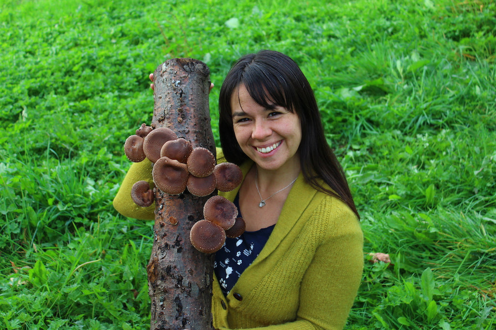 Happy woman with mushroom log