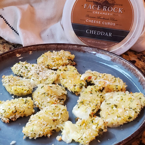 a plate of baked Face Rock Cheese Curds