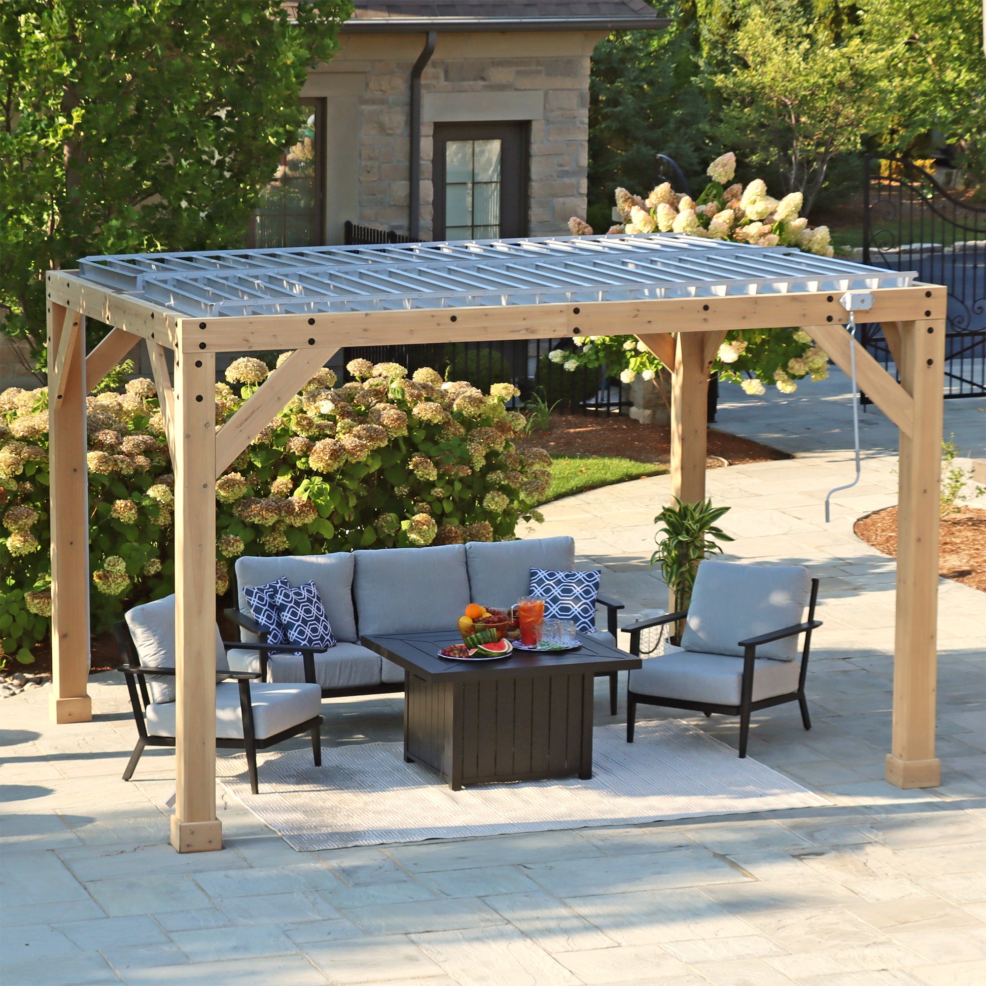 External view of the wooden support beams and louvered roof of the Meridian 10 x 12 Wood Room.