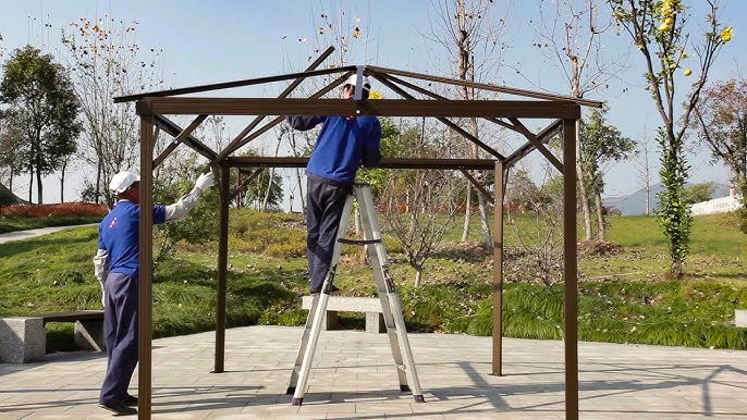 2 men assembling a metal frame gazebo