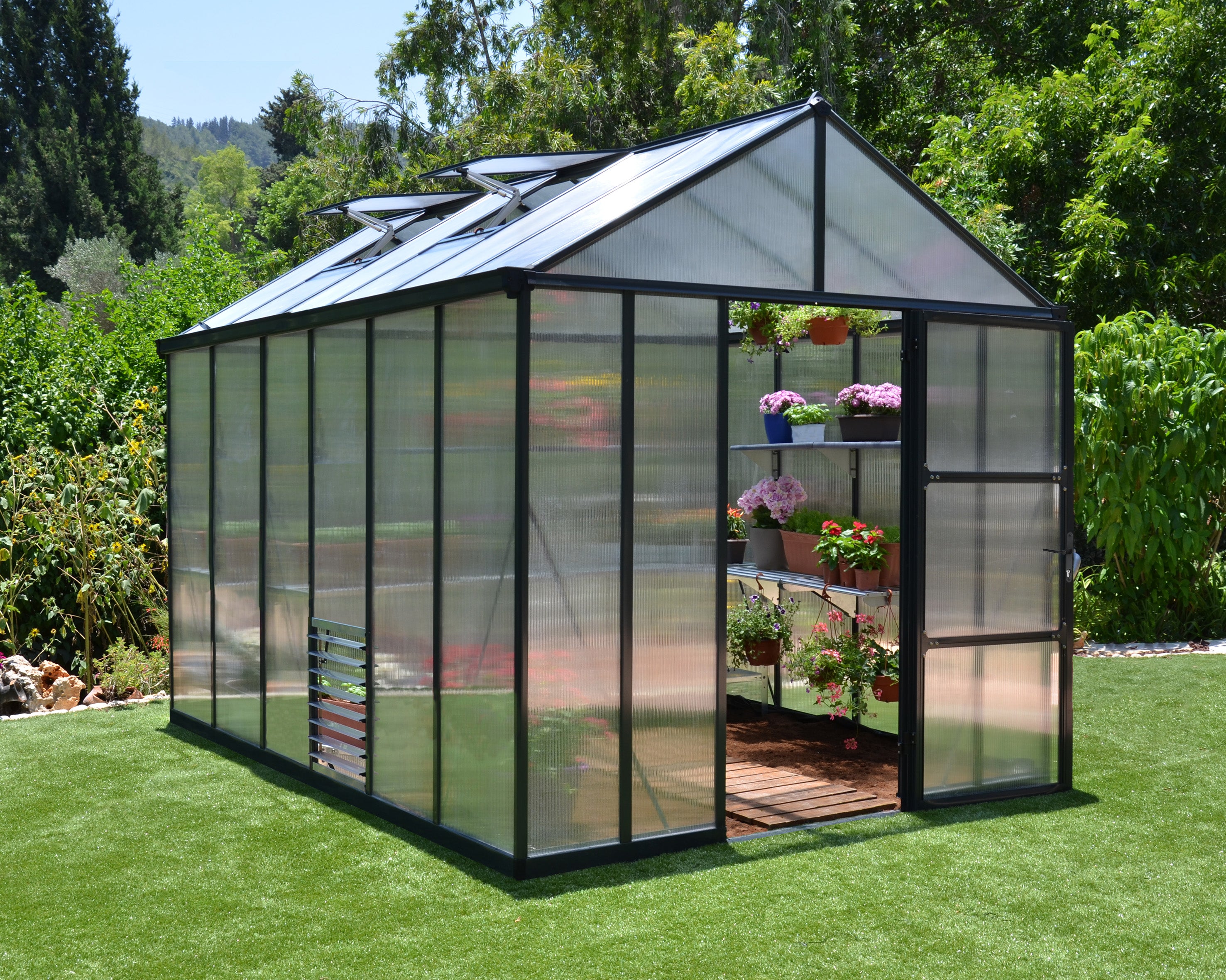 Canopia Glory Greenhouse 8x12 in a backyard setting.