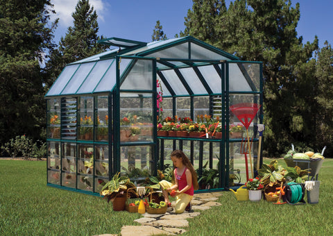 Canopia Prestige 8x8' Greenhouse - Clear with child placing fruits in the basket.