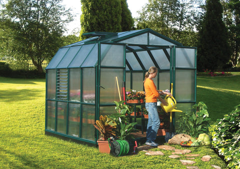 Canopia Prestige 8x8' Greenhouse - Twin Wall with woman watering plants.