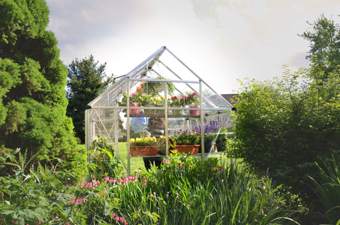 Canopia Snap & Grow 8x8' Greenhouse - Silver in a garden setting.