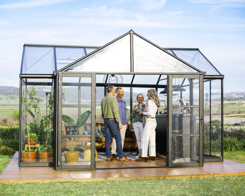 Canopia Triomphe Chalet 12' x 15' Greenhouse with people talking inside