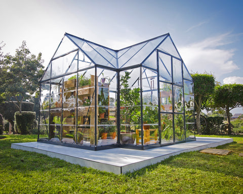 Canopia Chalet 12' x 10' Greenhouse in a garden setting