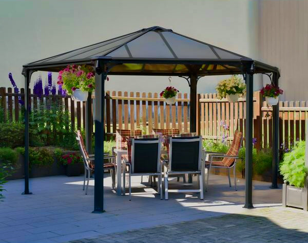 Canopia Monaco Hexagon Gazebo with outdoor dining set and hanging flowers