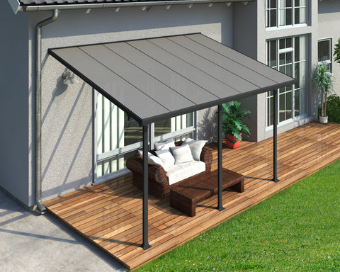 Canopia Feria 10' Patio Cover - Gray/Clear used beside a house with furniture.