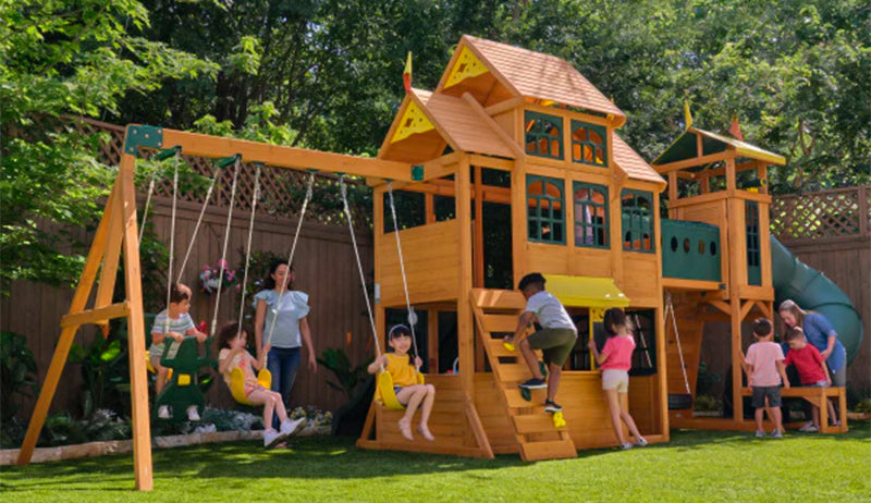 children playing on the Kidkraft Bear Cave Lodge Playset