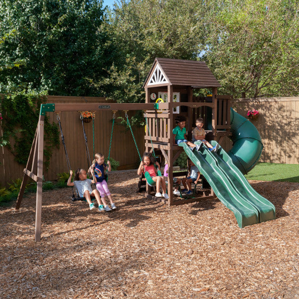 Kidkraft Portland playset on a backyard with kids