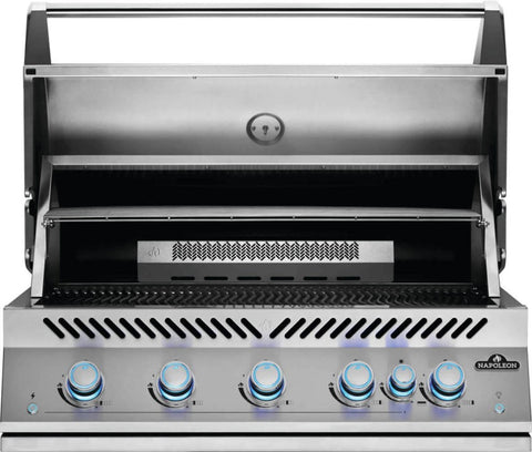 The interior view of the Napoleon Grills Built-In 700 Series 38-Inch RB 6-Burner Gas Grill Head with the lid open, displaying the warming rack and spacious grilling area.