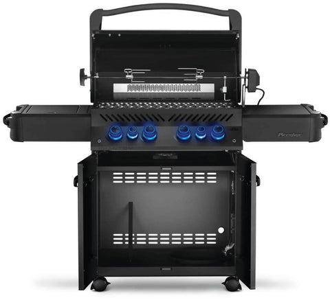 Napoleon Grills Phantom Prestige 500 RSIB 6-burner grill with lid open, rotisserie in use, and control knobs illuminated.