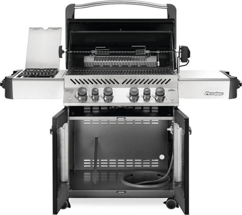 Interior view of the Napoleon Grills Prestige® 500 RSIB Grill with the lid open, showing the cooking grids and warming rack.