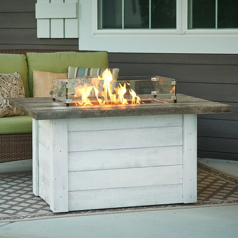 Alcott Rectangular Gas Fire Pit Table featuring a glass guard around the flame area for safety and wind protection.