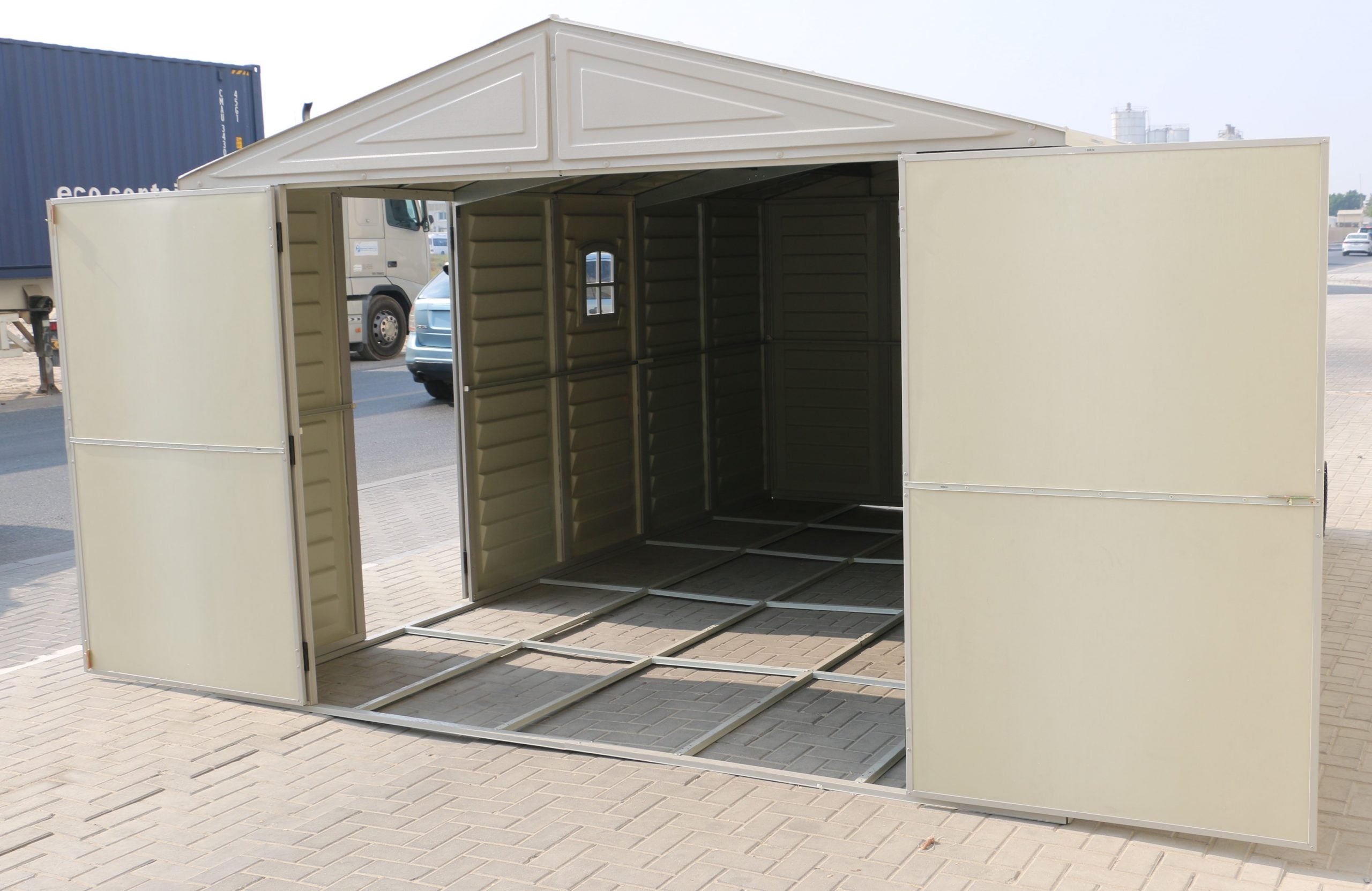 Open view of Duramax Vinyl Garage 10 ft with Foundation Kit, showcasing the spacious and versatile interior, ideal for organized and secure storage.