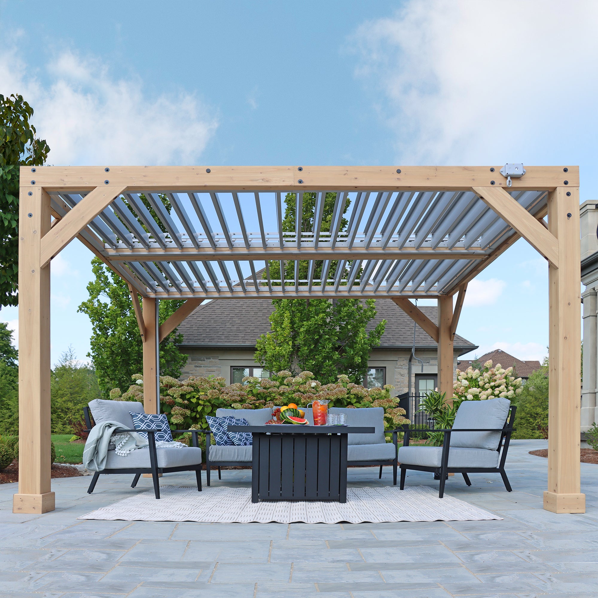 Underneath view showing the intricate wooden structure and louvered roof of the  Yardistry 10 x 12 Meridian Wood Room.