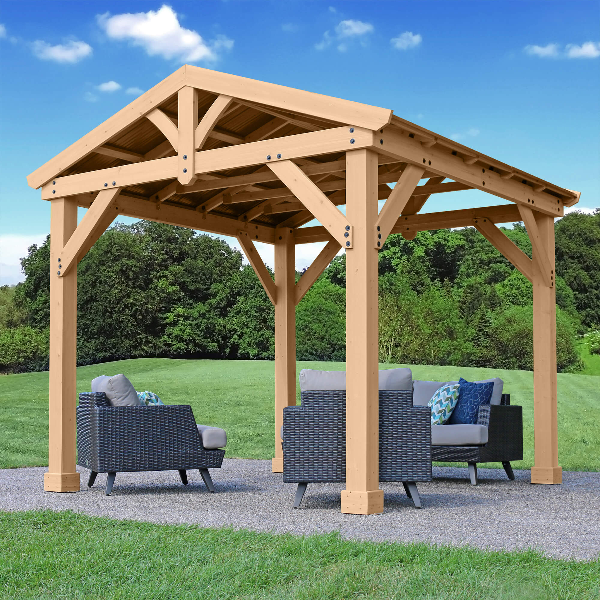 Sturdy Yardistry Meridian Cedar Pavilion with a sleek aluminum roof, sized 10x10, set in a verdant garden, ideal for outdoor relaxation and gatherings.