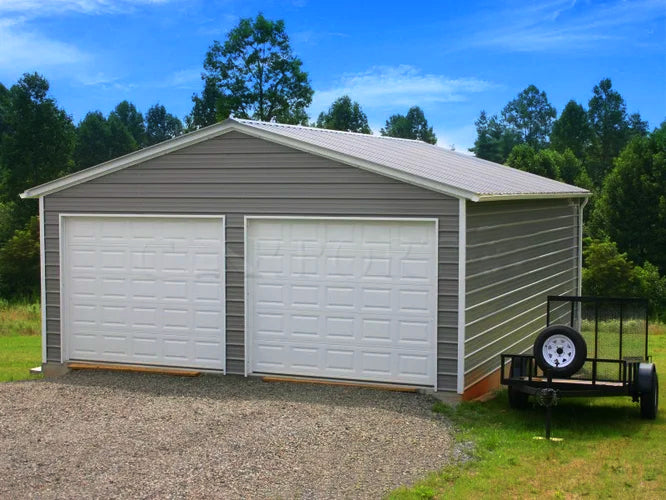 detached garage with double door on a lawn
