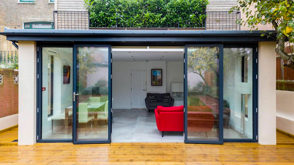 detached garage converted to extra living space with glass doors