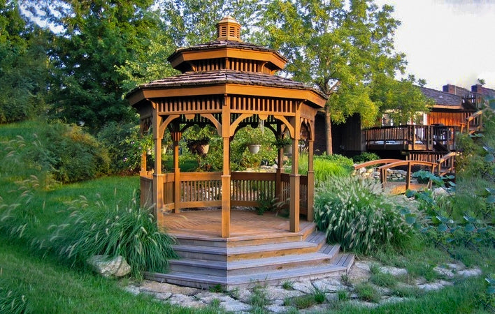 hexagon gazebo raised on a deck with stairs