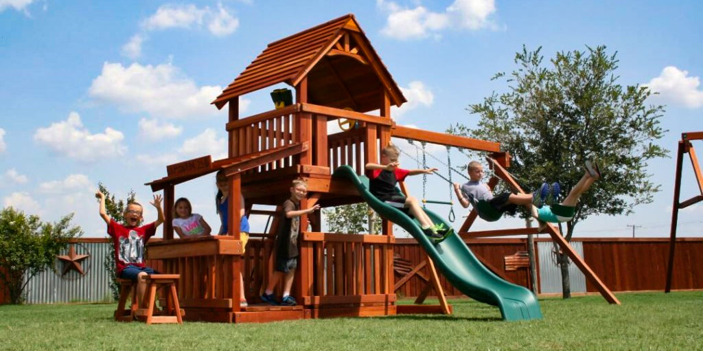 medium sized redwood playset with children playing