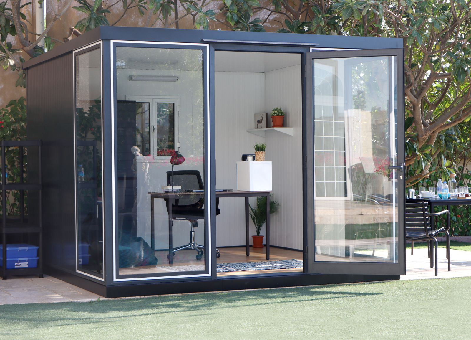 Duramax insulated glass building as an outdoor office with front door open.