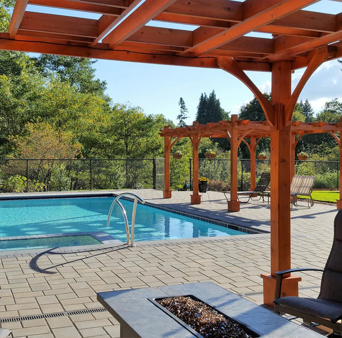 outdoor living today breeze pergola with fire table and outdoor furniture beside pool