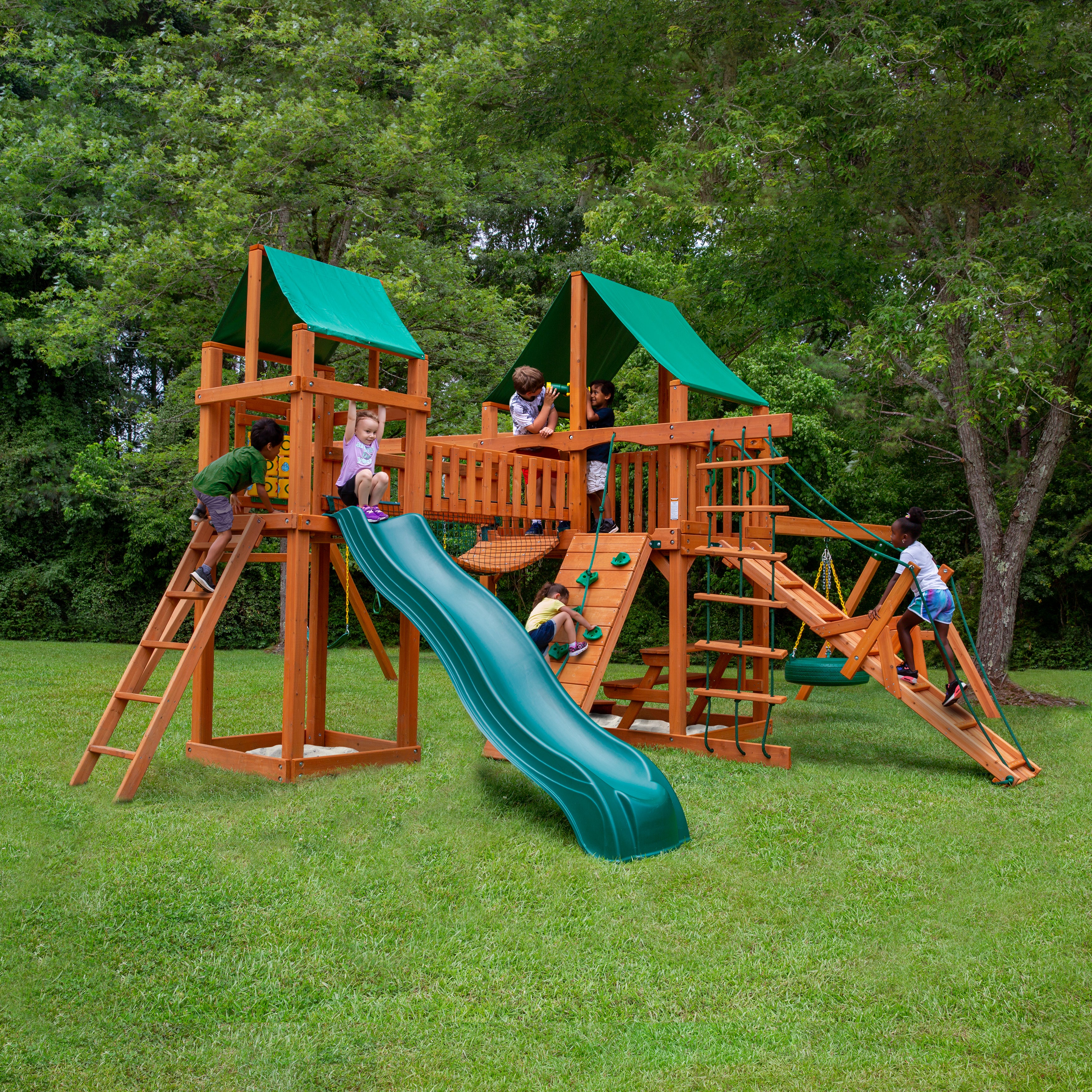 Gorilla Pioneer Peak Swing Set in an outdoor setting with kids