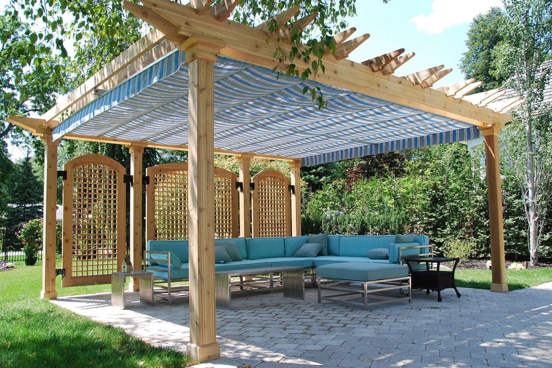 pergola with retractable canopy and side wall with outdoor furniture