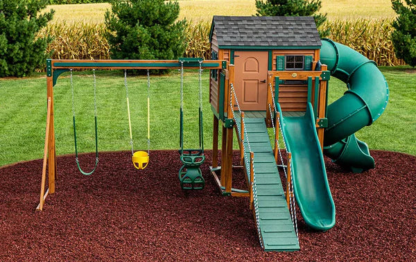 playset with two slides on a rubber mulch