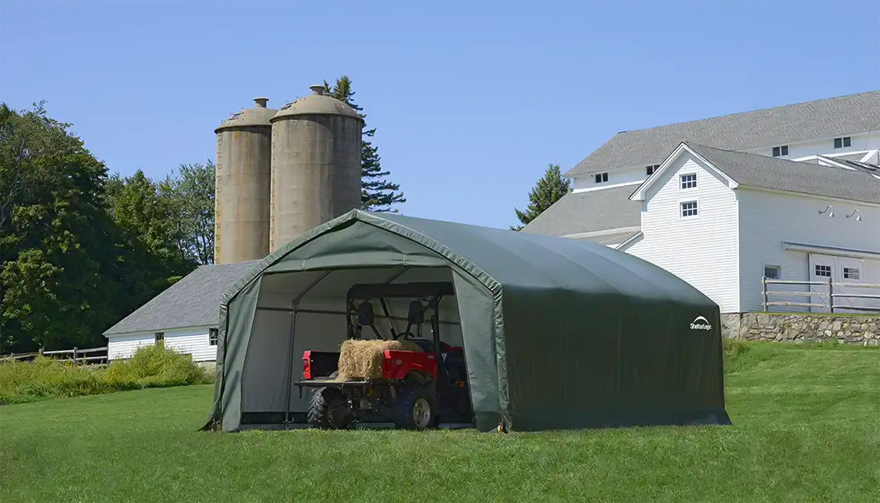 shelterlogic detached garage with tractor inside