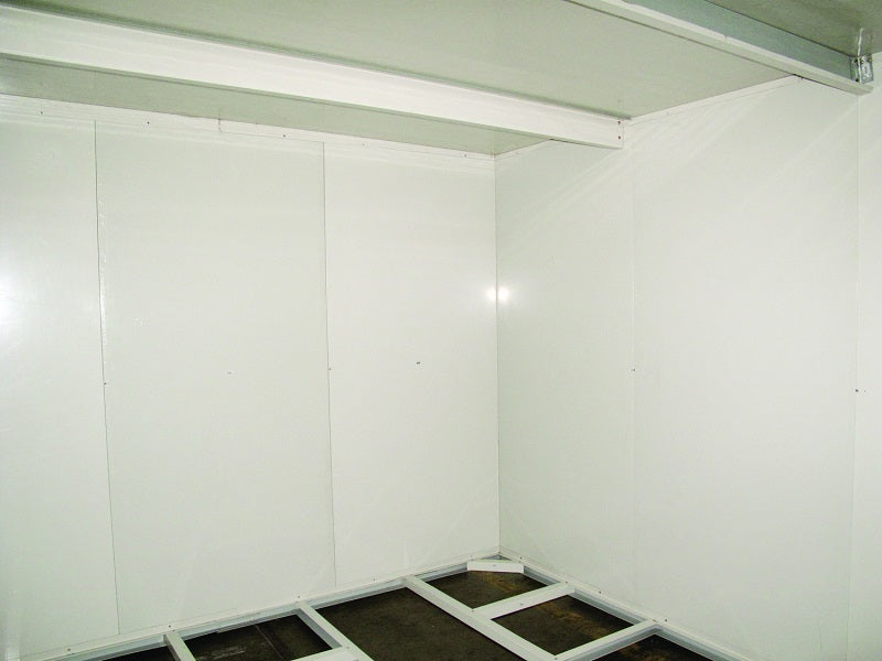 Inside view of a Duramax insulated storage building, highlighting the spacious interior and sturdy construction suitable for secure equipment or tool storage.