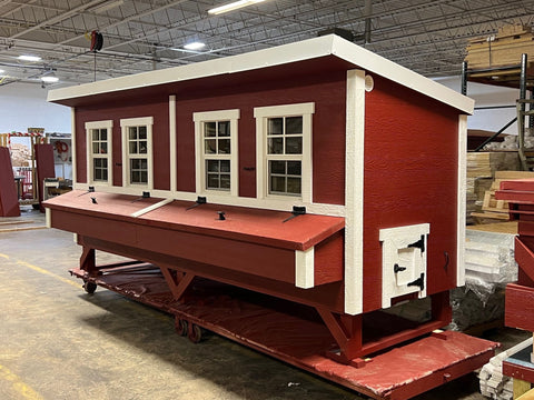 Quarter front view of the OverEZ Jumbo Chicken Coop in red and white, emphasizing its robust build and capacity for up to 30 chickens.