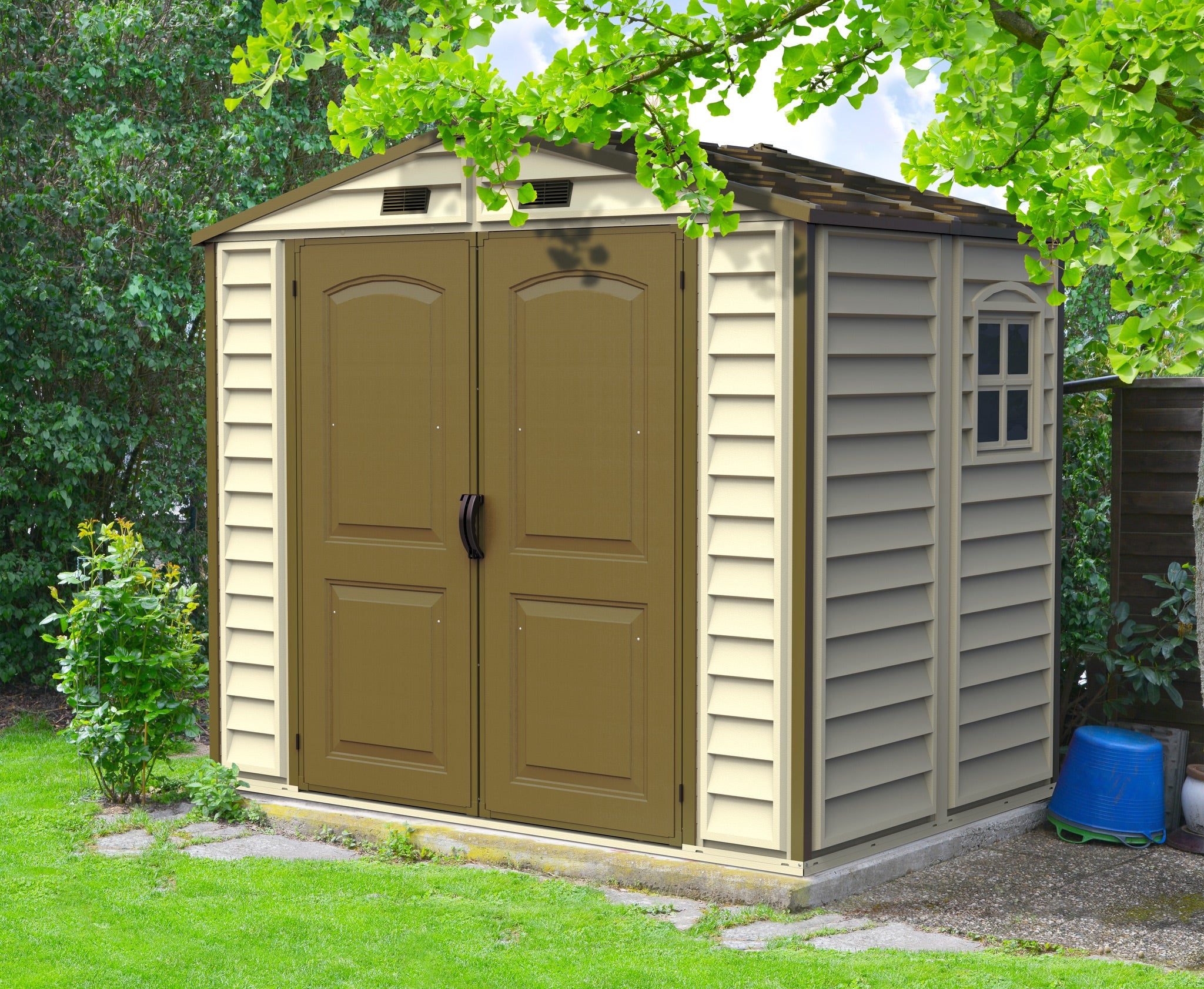 Duramax DuraPlus 8x8 Outdoor Shed with Foundation in a lush garden setting.