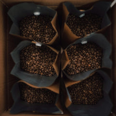 Box of coffee beans in individual bags