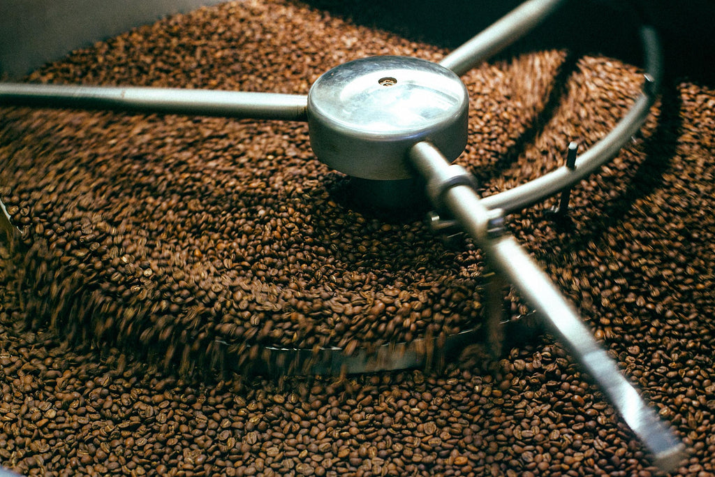 Coffee beans in a roasting machine.
