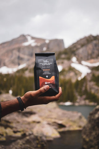 Holding A Bag of Coffee in Rocky Mountain National Park